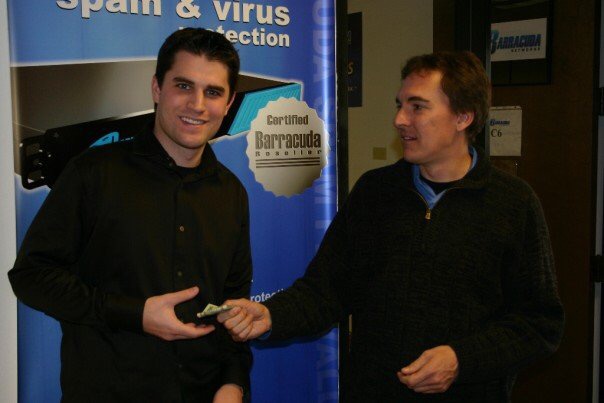 Sean Heiney with Barracuda Networks founder and CEO Dean Drako at a Barracuda spam and virus protection stand