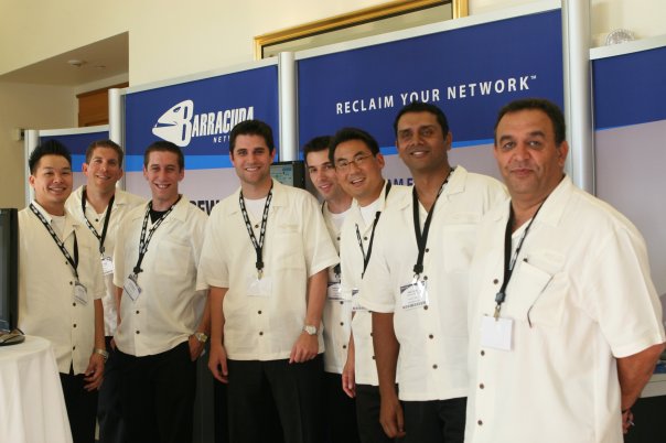 The Barracuda product team at a launch event, in front of a Barracuda Networks banner reading Reclaim Your Network