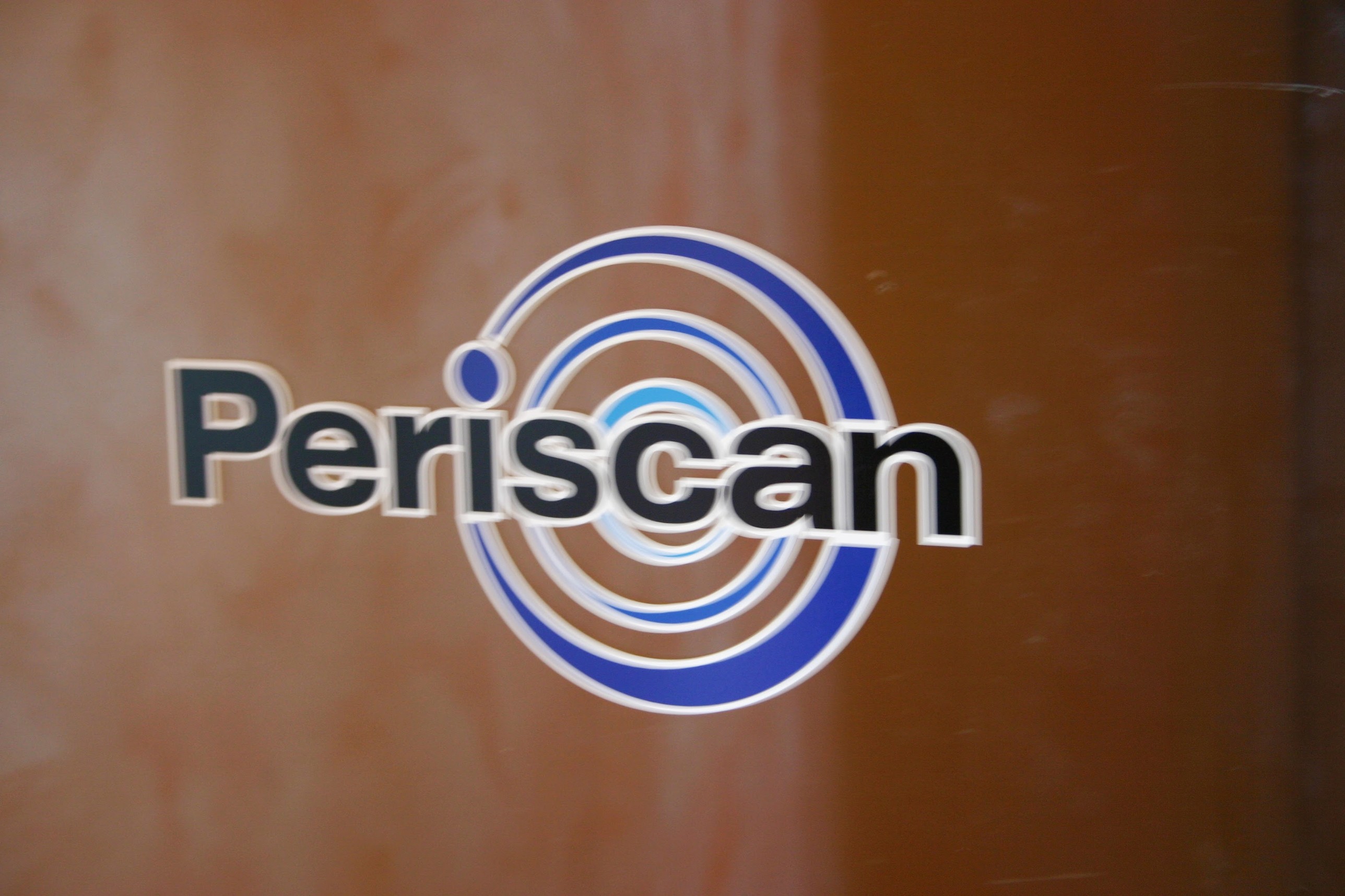 The original Periscan logo on the office door